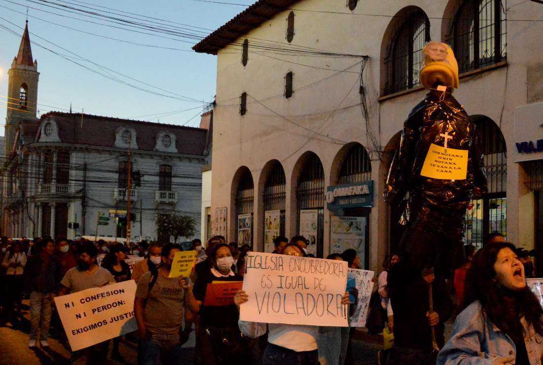 Members of children's rights organizations protest against cases of pederasty by Catholic priests in past decades in Cochabamba, Bolivia, on May 25