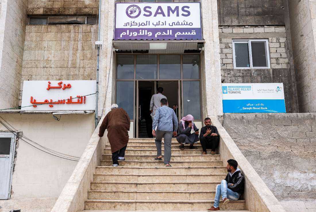 In this picture taken on May 2, people enter the complex serving as the Thalassemia center and the Haematology and Oncology department run by the Syrian American Medical Society (SAMS) at Idlib Central Hospital in the rebel-held northwestern Syrian city