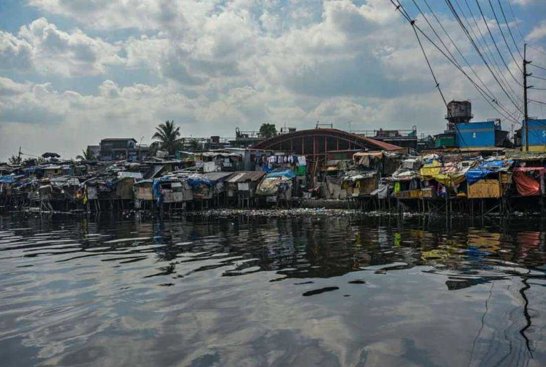 A general view of a slum area along the river in Manila on March 18, 2020. The Emmanuel Community Hospital in Tondo of Manila which serves the poor is among the 137 state properties listed for privatization in 2023