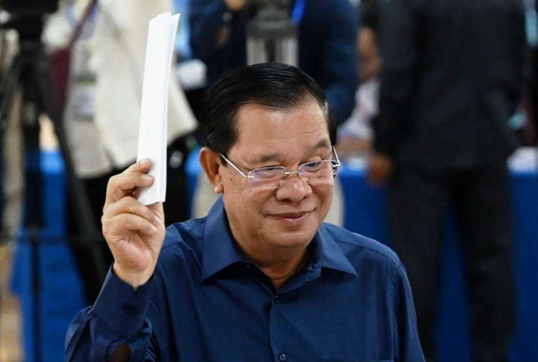 Cambodia's Prime Minister Hun Sen prepares to cast his vote at a polling station in Kandal province on July 23 during the general election