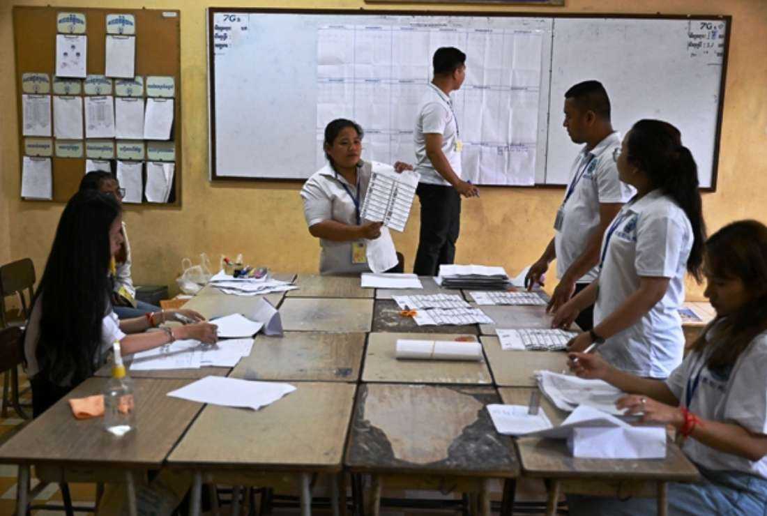 Cambodian election officials count ballots at a polling station in Phnom Penh on July 23 during the general elections. The United States, the European Union and human rights groups have urged the international community not to recognize the results of the one-sided election