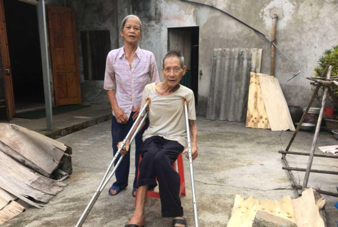 Elderly Vietnamese couple, Dominic Tran Van Ha and his wife Mary Do Thi Suu, outside their home in Tran Yen district of the northwestern province of Yen Bai