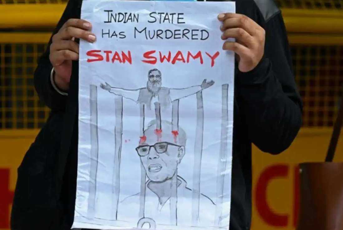 A student takes part in a demonstration in New Delhi on July 6, 2021, after the Indian rights activist and Jesuit priest Father Stan Swamy, who was detained for nine months without trial under Indian anti-terrorism laws died on July 5 ahead of a bail hearing