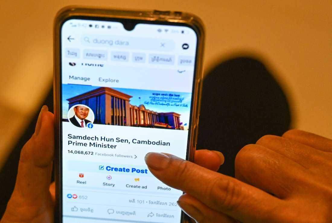 This photo illustration shows a post on Facebook by Cambodian government official Duong Dara, which includes an image of the official Facebook page of Cambodia's Prime Minister Hun Sen before he deleted his account, in Phnom Penh on June 30