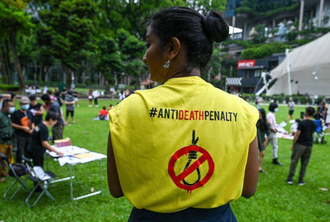 An activist wears a T-shirt with a sign against the death penalty during a protest against the death penalty at Speakers' Corner in Singapore on April 3, 2022