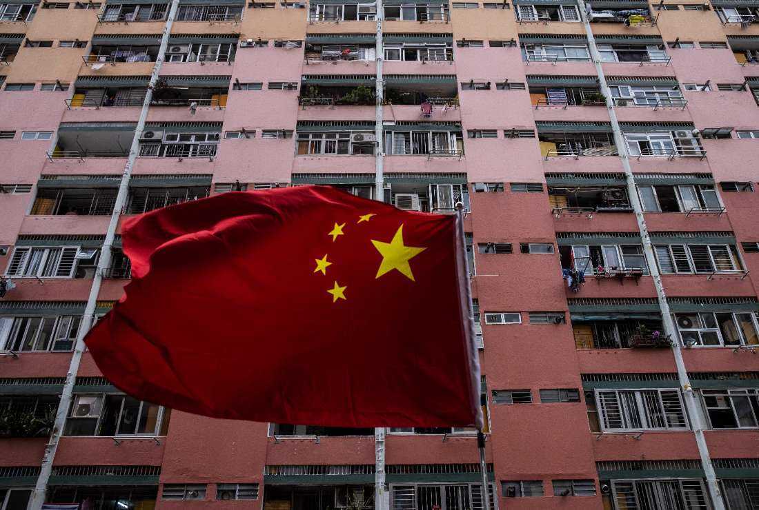 A Chinese flag is seen in front of a housing estate in Hong Kong on June 29 ahead of the 26th anniversary of the city’s handover from Britain to China on July 1
