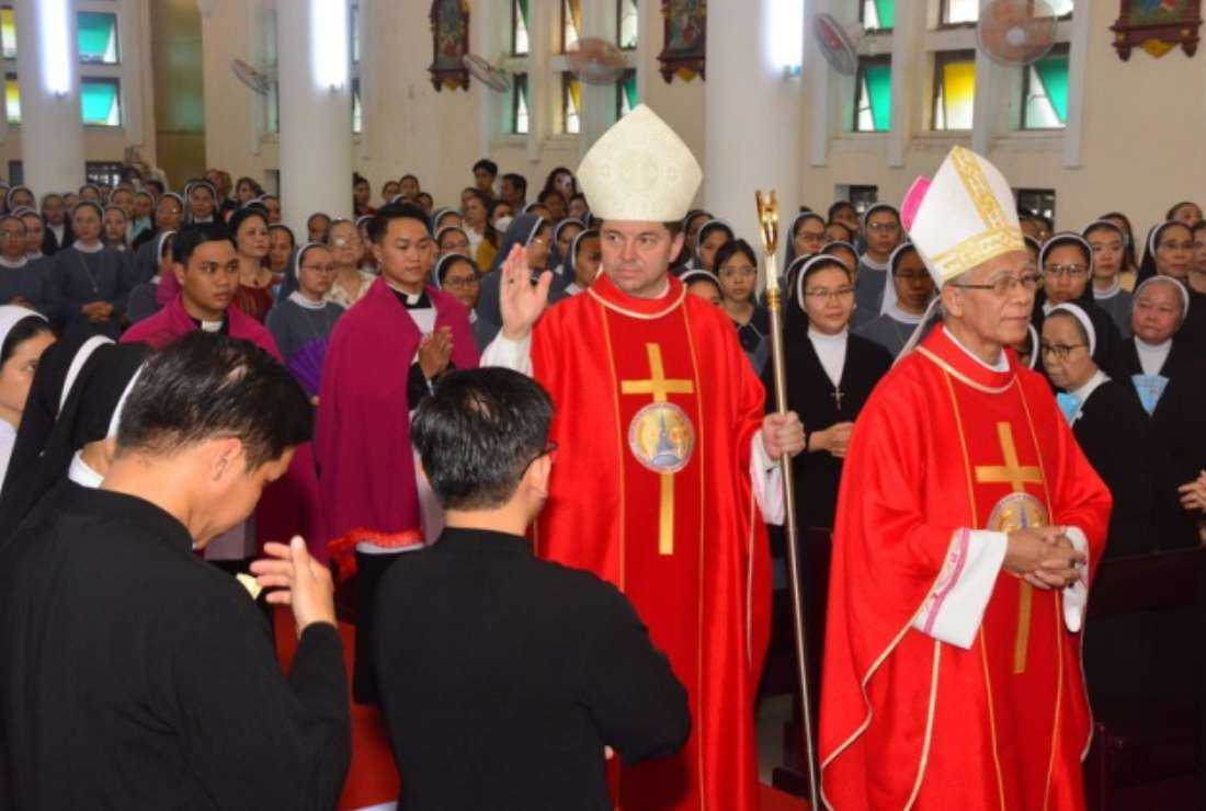 Poland Archbishop Marek Zalewski, the second non-resident representative of the Holy See to Vietnam, blesses Catholics at Qui Nhon Cathedral on July 14