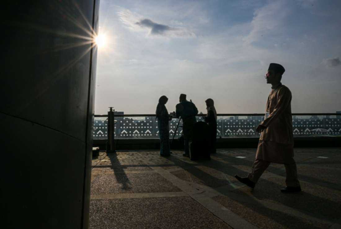 Officials in Malaysia use a telescope to perform a 'rukyah,' the sighting of the new moon for the Muslim holy fasting month of Ramadan, in Putrajaya on March 22