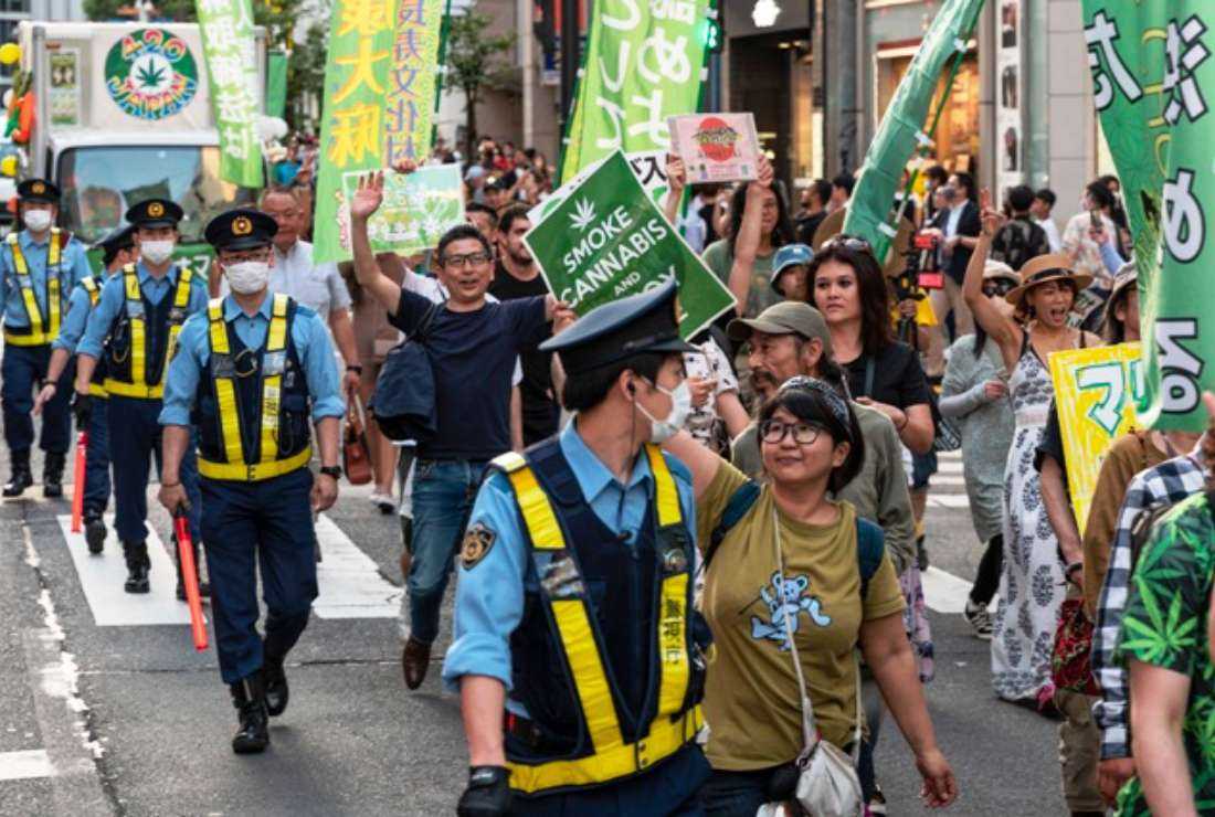 People take part in a march to call for the legalization of cannabis (marijuana) in the streets of Shibuya in Tokyo on May 4. The country and society still have a zero-tolerance policy on the recreational use of marijuana in stark contrast to its Western counterparts