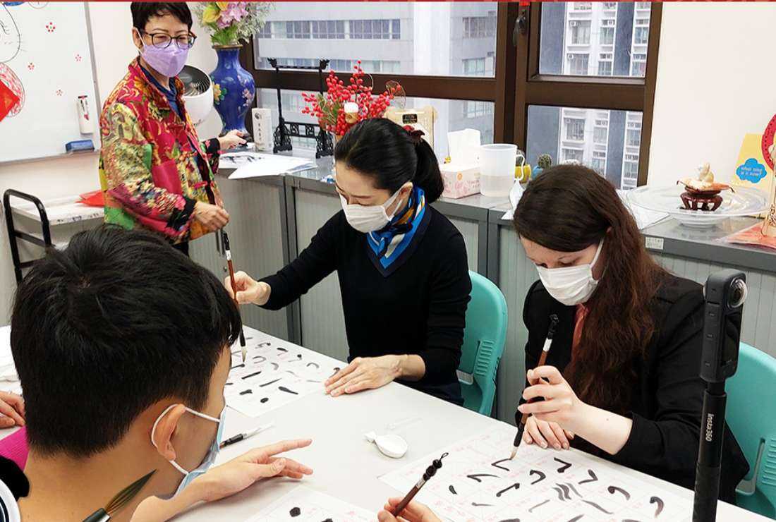 Students are pictured participating in a calligraphy workshop at the Hong Kong Language Learning Association in this picture released on Jan. 13, 2020