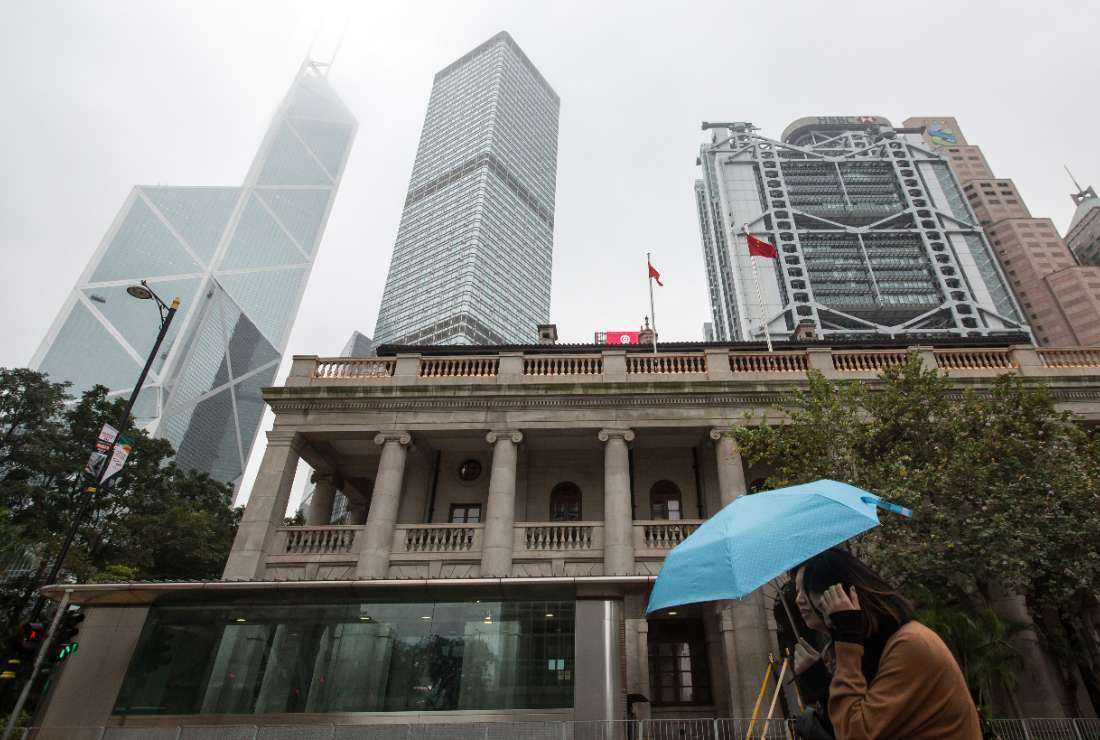 This picture taken on Jan. 6, 2018, shows a pedestrian walking past the Hong Kong Court of Final Appeal building in Hong Kong