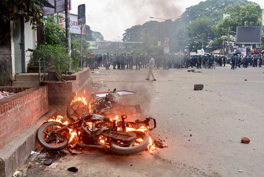 Supporters of Islamist leader Delwar Hossain Sayedee set fire to motorcycles in Dhaka on Aug. 15