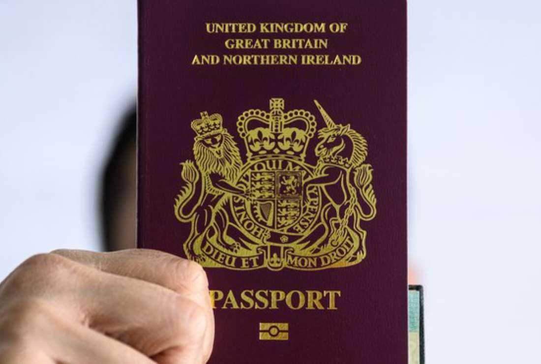 A Hong Kong resident holds the British National Overseas (BNO) passport in this file