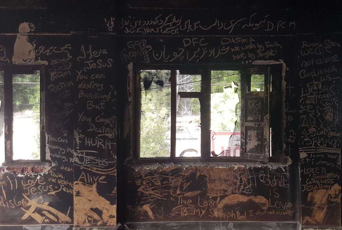 The messages for Christians are written on the ash-covered wall of the Salvation Army Church in Jaranwala, a Christian settlement in Pakistan's Punjab province, where at least 19 churches were destroyed on Aug. 16 during an anti-Christian violence