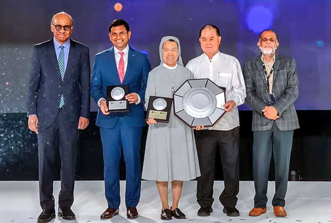 Canossian Sister Theresa Seow (center) pose for a photo after receiving the Exemplary Interfaith Award from Jamiyah Singapore on July 29