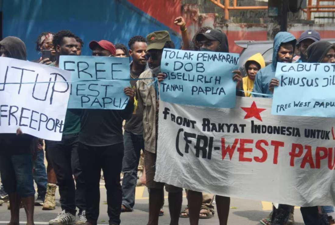Students protest the Indonesian government's plan to develop new administrative areas in the country's easternmost Papua province on May 10, 2022