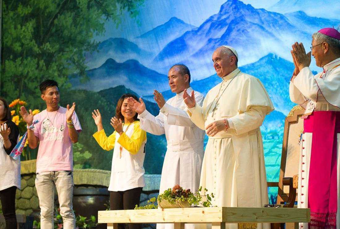 Pope Francis is seen with young people during his visit to South Korea in 2014