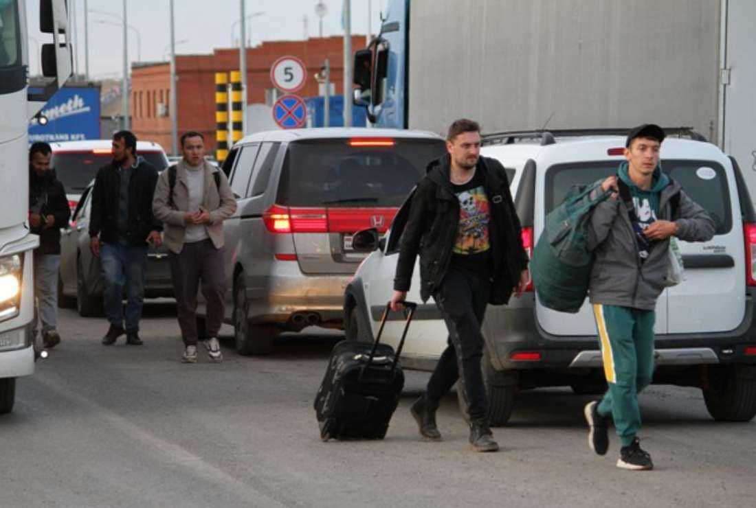 Russians arrive in Kazakhstan crossing the Syrym border crossing point on Sept. 27, 2022. Russian President Vladimir Putin's announcement of a mobilization of hundreds of thousands of Russian men to bolster Moscow's army in Ukraine sparked demonstrations and an exodus of men abroad