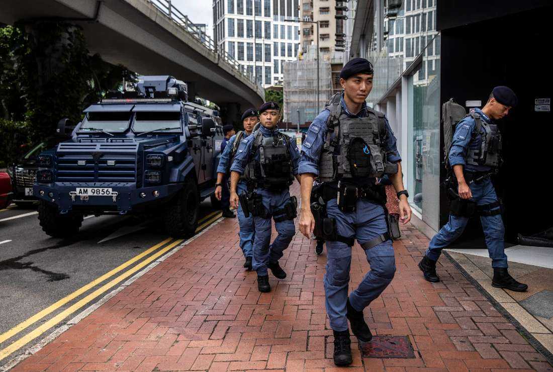 Police patrol near a carnival at Victoria Park to celebrate the 26th anniversary of the city's handover from Britain to China, in Hong Kong on July 1.