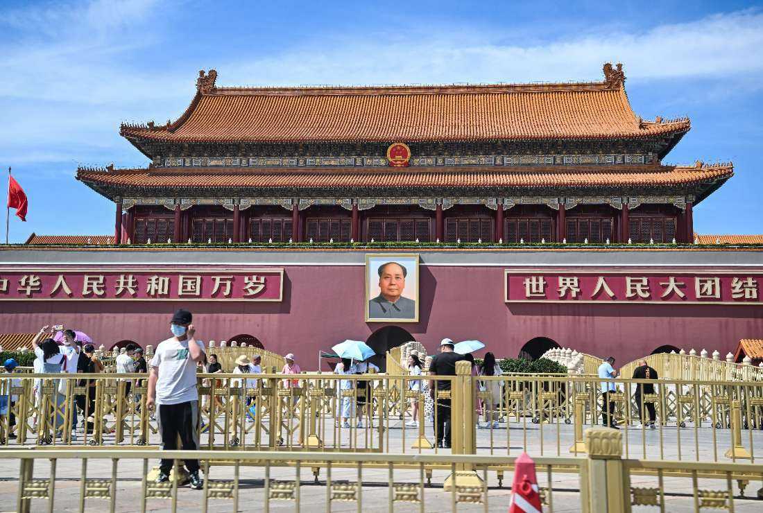 People walk around the Tiananmen Gate in Beijing on June 4 during the 34th anniversary of the 1989 crackdown on pro-democracy protests