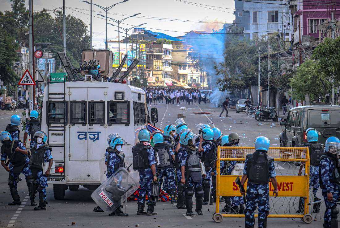 Security personnel fire tear gas as students protest against the killing of two missing students by unknown miscreants and to demand peace in India's northeastern state of Manipur amid ongoing ethnic violence, in Imphal on Sept. 27.