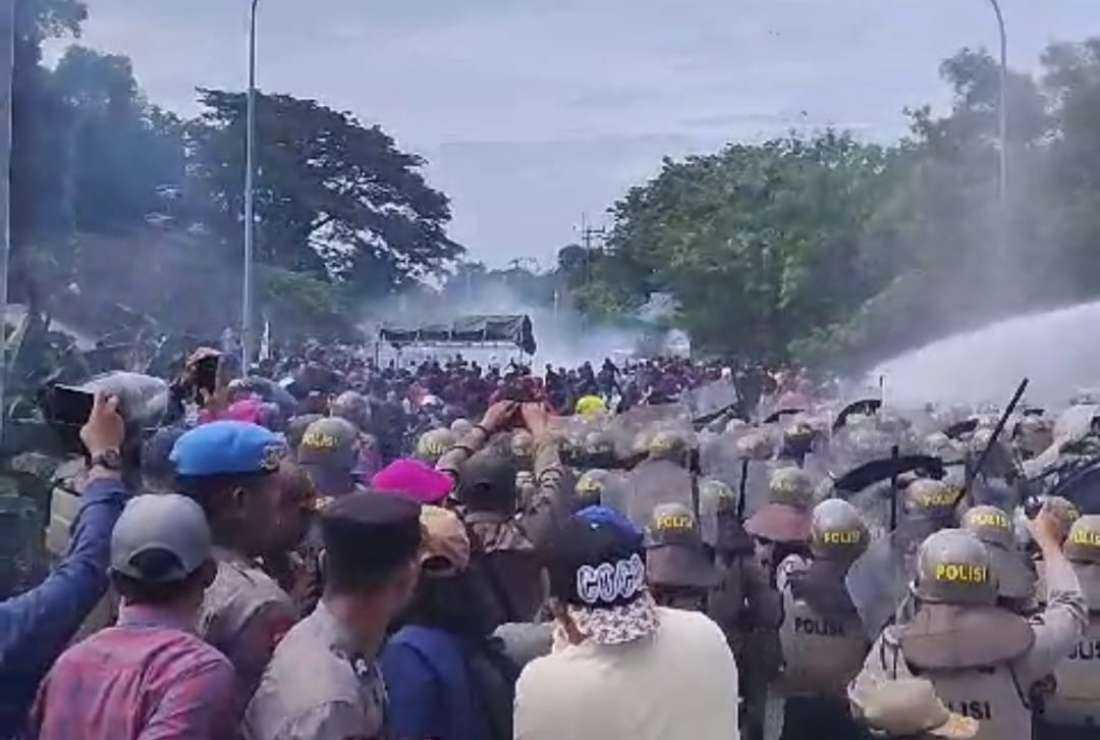 Police confront demonstrators in Rempang, Riau Islands of Indonesia on Sept. 7 during a protest rally against a tourism project