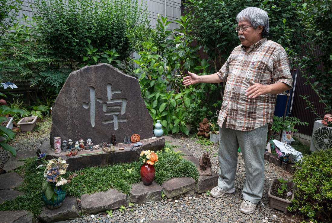 This photo taken on June 21 shows Masao Nishizaki, director of the Housenka Foundation - a civic group working on the events following the 1923 earthquake when many Korean residents were massacred - speaking about the memorial for the victims outside his home in Sumida Ward in Tokyo