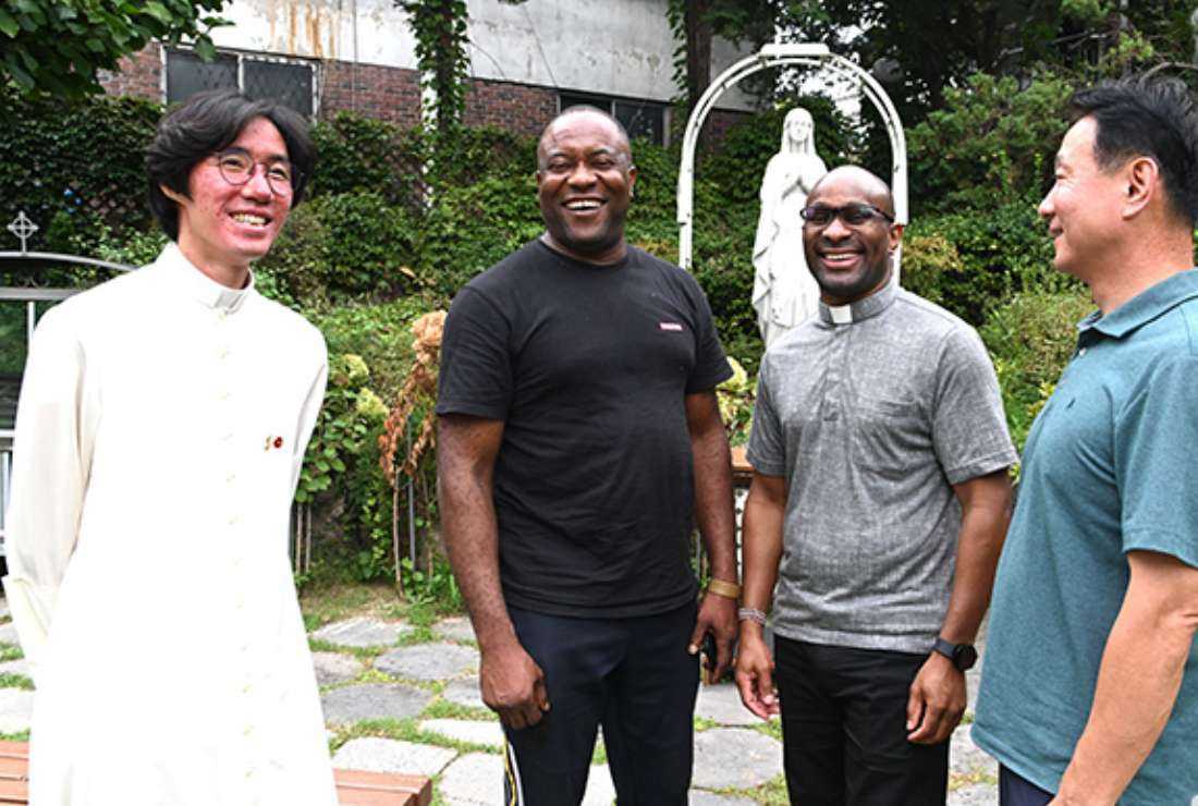 Father Lee Jong-won (far left), pastor of Dongducheon parish of  Uijeongbu Catholic Diocese, and Father Clement K. Gachoka, (second from right), director of Dongducheon International Catholic Community are seen with immigrants in this undated image. The diocese has been helping immigrants to integrate into Korean society