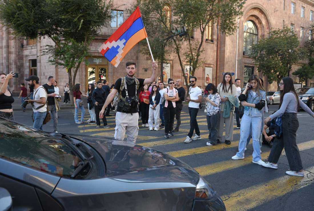 Protestors block a street in downtown Yerevan on Sept. 20 as separatists in Nagorno-Karabakh and Azerbaijan's authorities announced they would cease hostilities, signaling the end of an 'anti-terror' operation launched just one day earlier by Azerbaijan's forces in the breakaway region