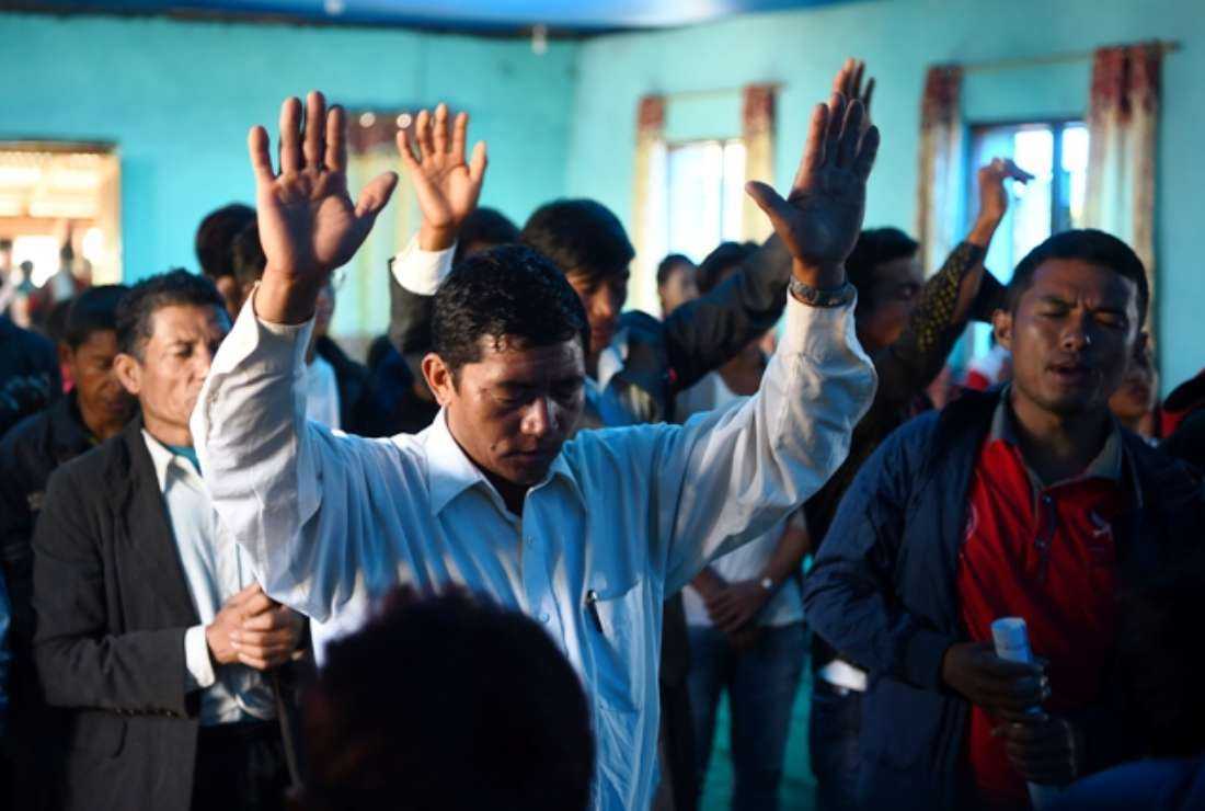 Nepali Christians take part in a church service in Lapa village in Dhading, some 100 km northwest of Kathmandu, on Oct. 8, 2017. Despite strict laws that ban religious conversion, Christianity has spread rapidly over the last two decades in Nepal, where many see it as an escape from the deeply entrenched caste system