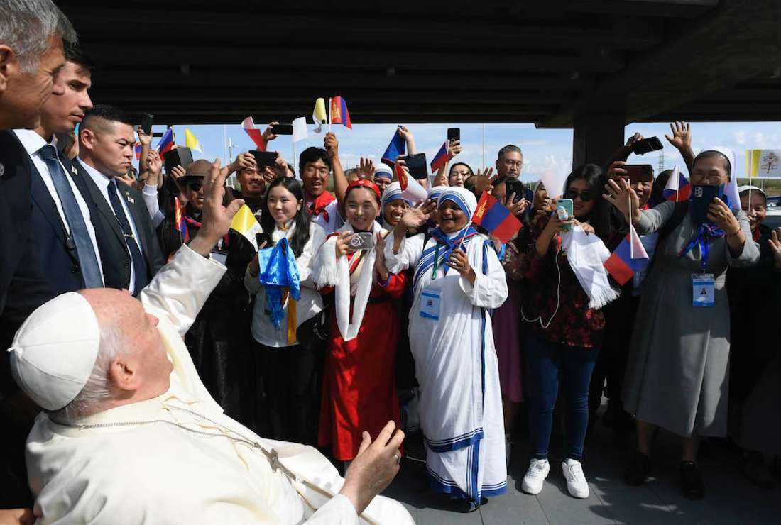 This handout photo released by Vatican Media on Sept. 1 shows people greeting Pope Francis upon his arrival at the Apostolic Prefecture of Ulaanbaatar