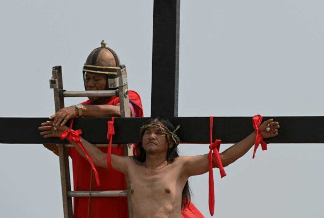  Ruben Enaje (right) performs his 34th re-enactment of the crucifixion of Jesus Christ on Good Friday in San Fernando, Pampanga province in the Philippines on April 7. In several Asian nations, Christianity is widely but inaccurately perceived as a mere colonial import and research on the current social realities of Asian Catholic life remains limited. (Photo: AFP)