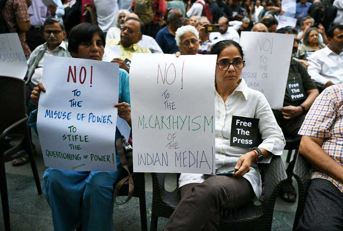 Indian journalists hold placards during a protest in New Delhi on Oct. 4.