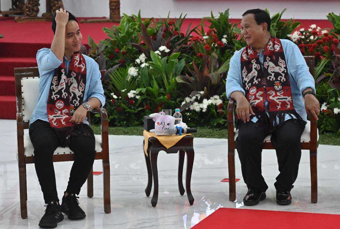 Presidential candidate Prabowo Subianto (R) and vice presidential candidate Gibran Rakabuming Raka (L), son of President Joko Widodo, attend the registration for the 2024 election in Jakarta on Oct. 25. 