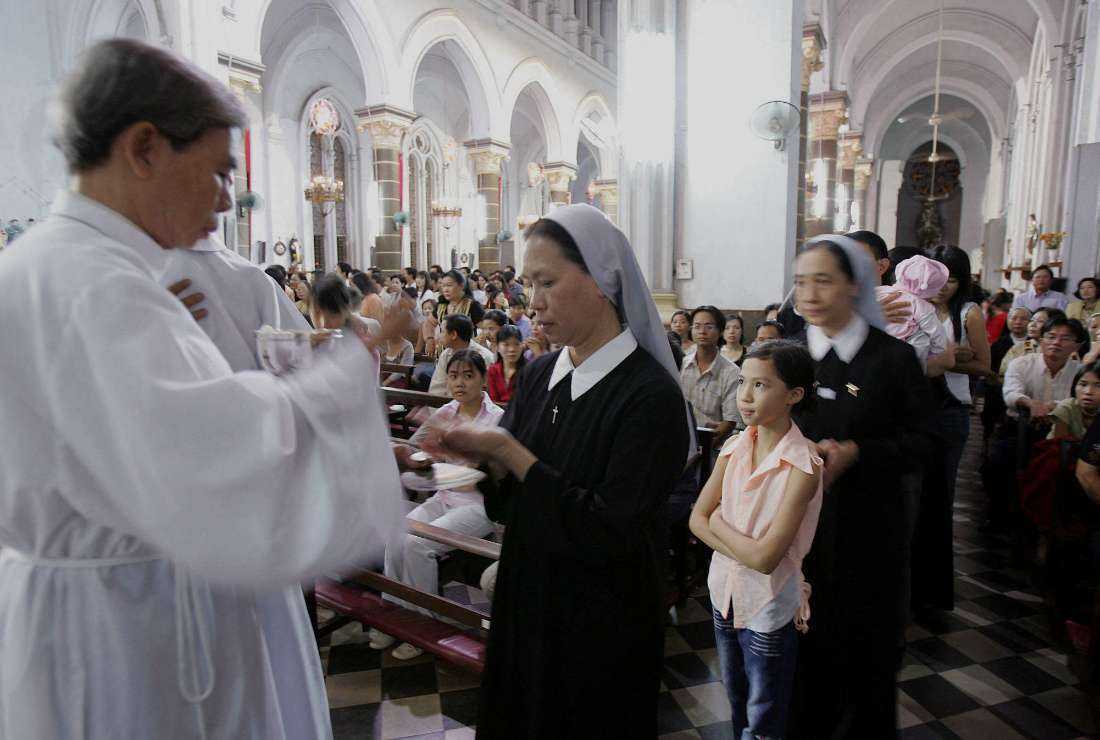 A Mass in progress in a Catholic church in Ho Chi Minh-City