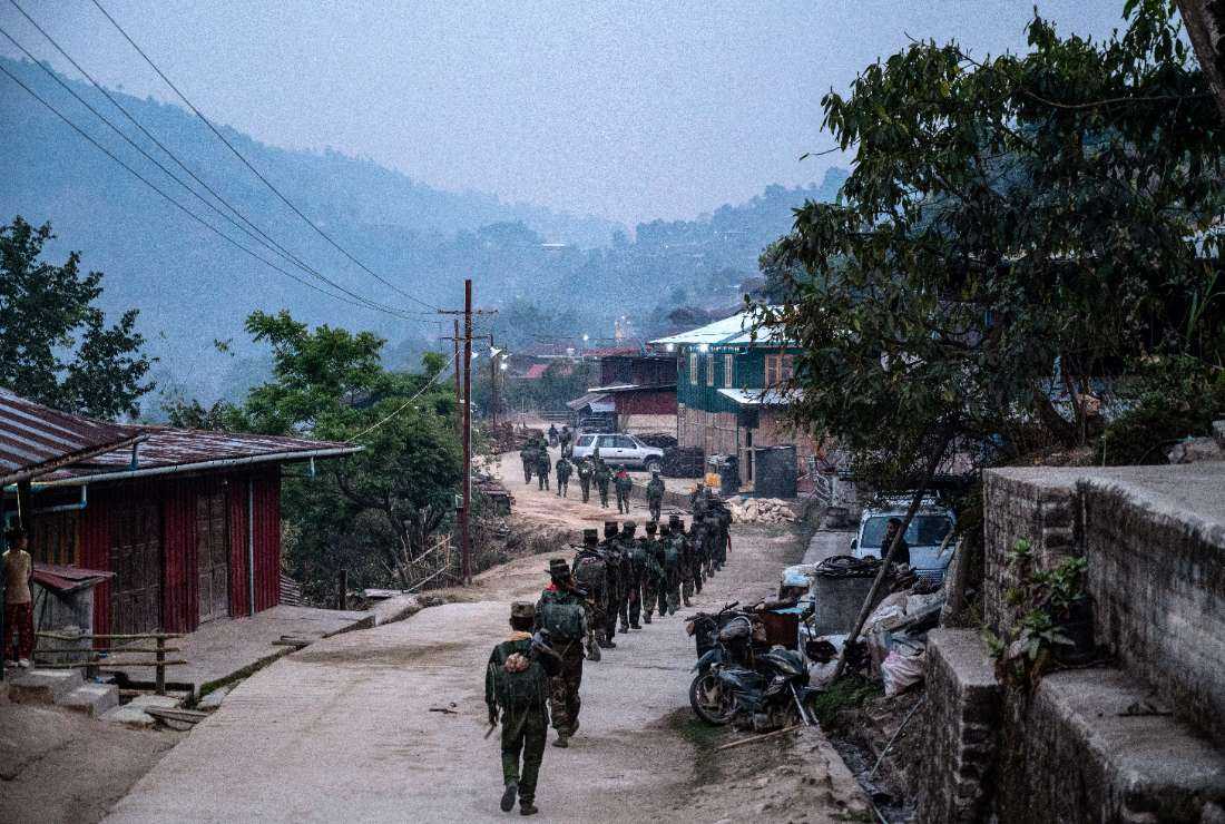 In this photo taken on March 9, members of the ethnic rebel group Ta'ang National Liberation Army (TNLA) patrol near Namhsan Township in Myanmar's northern Shan State. 