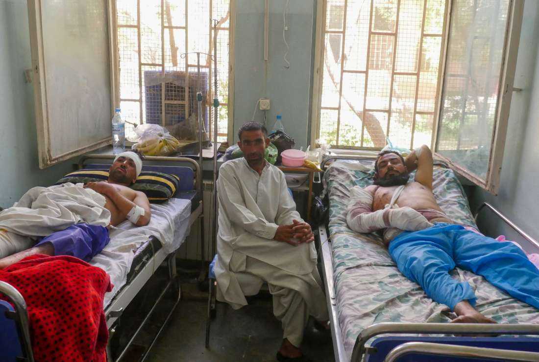Wounded men receive treatment at a hospital following a blast during the Friday prayer in Gazargah mosque, in Herat, Afghanistan on Sept. 3.