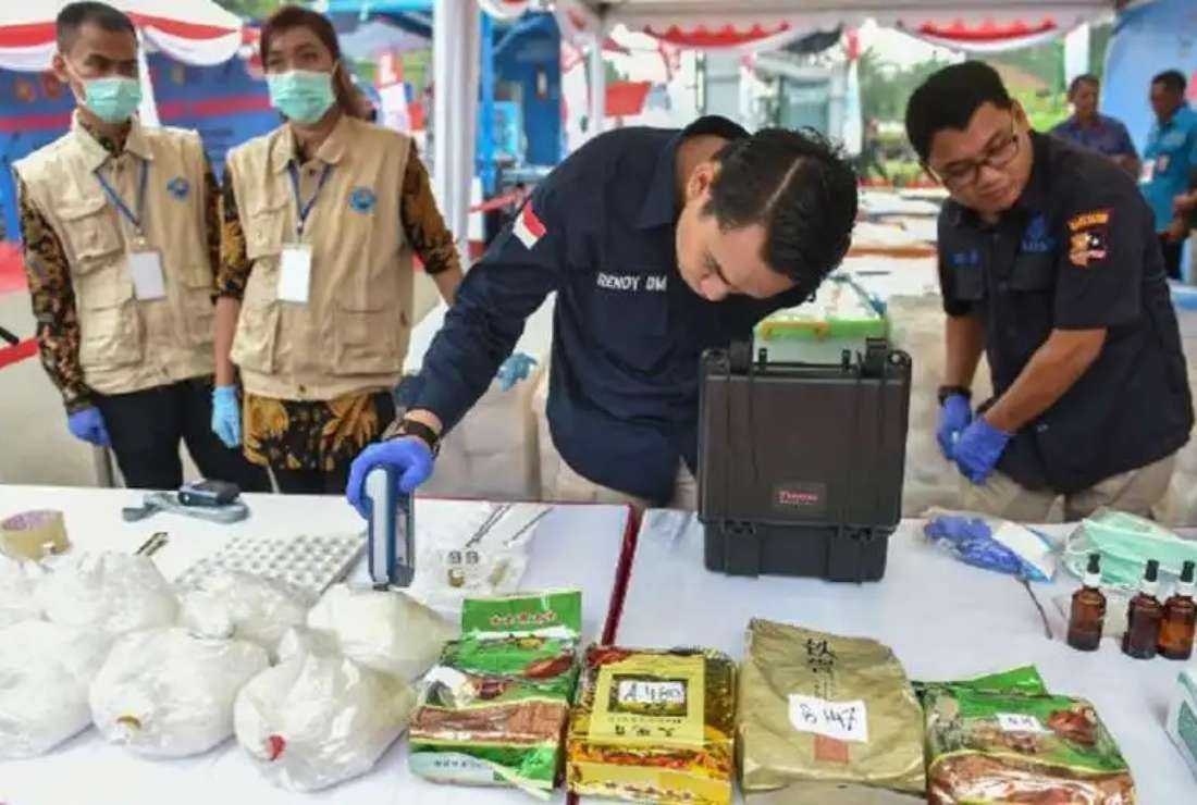 Indonesian police and drugs agency members display packs of methamphetamine before authorities destroyed 2.6 tons of crystal meth in Jakarta in this 2018 file photo