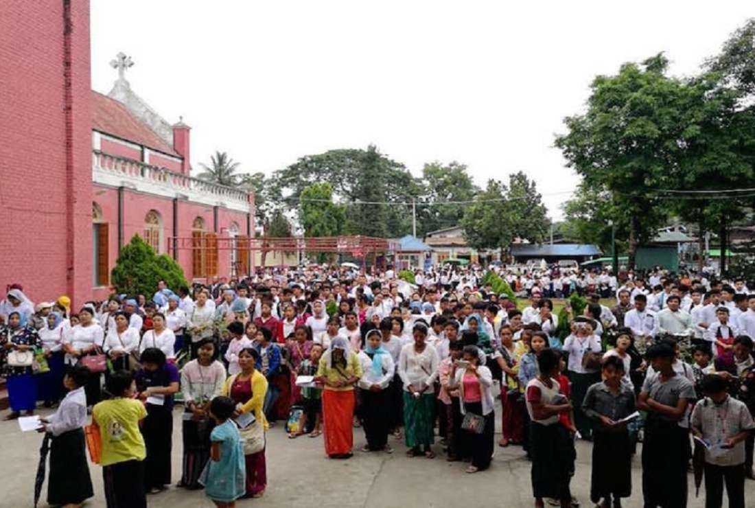 Catholics form a procession at the Marian grotto at St. Columban's Cathedral in Myitkyina, the capital city of Kachin State 