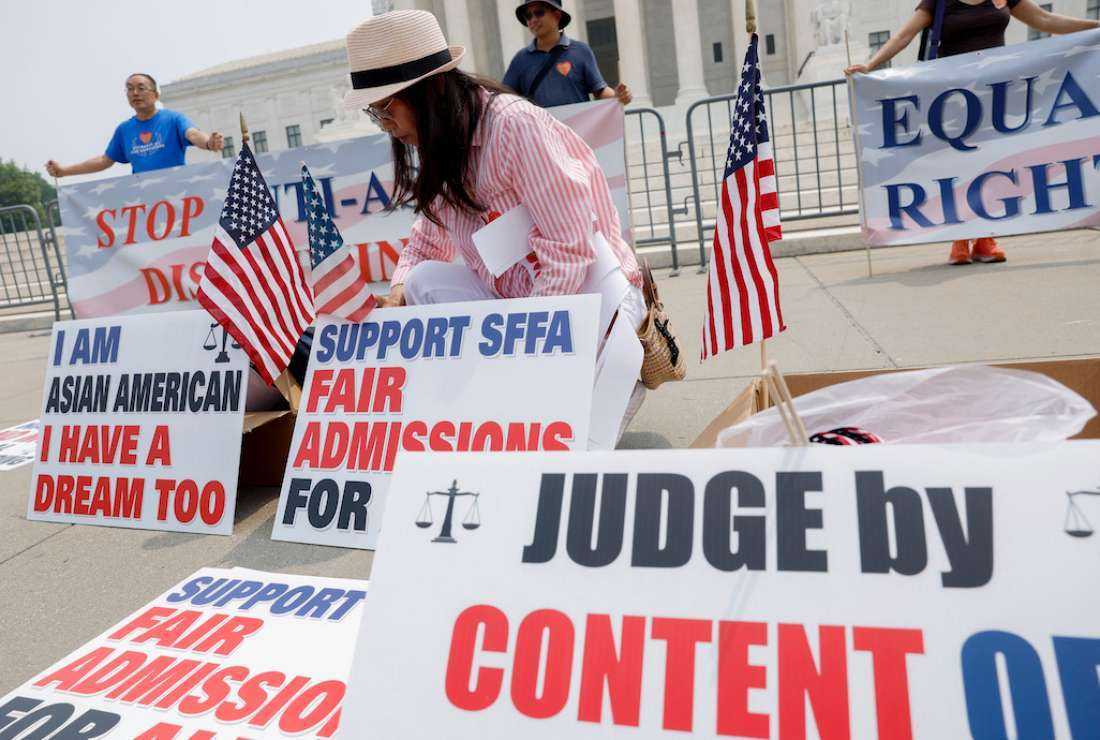 Anti-affirmative action activists with the Asian American Coalition for Education protest outside the US Supreme Court Building on June 29, in Washington, DC