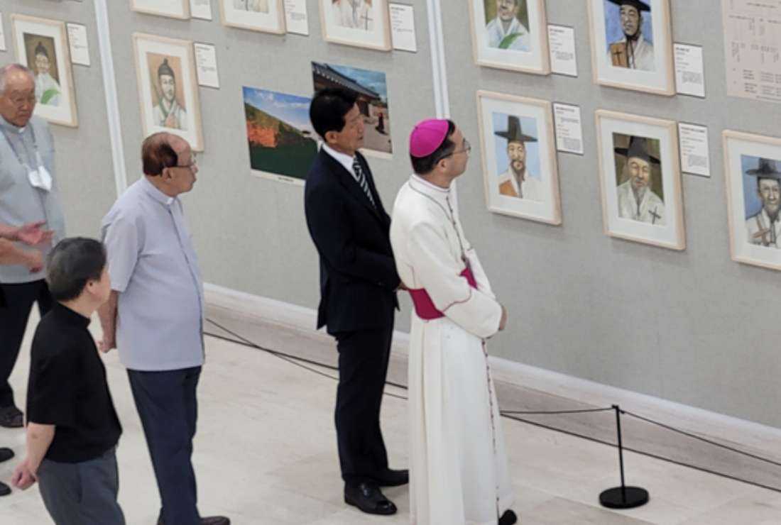 Visitors look at the portraits of Korean Catholic martyrs at Jeonju Shrine of South Korea in September. 