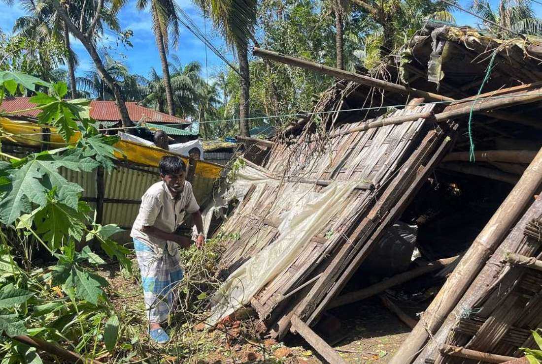 A man inspects his damaged home in Cox's Bazar of southeast Bangladesh after Cyclone Hamoon made landfall, on Oct 25