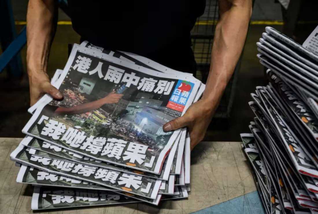  An Apple Daily employee works in the printing room after the last edition of the newspaper is printed in Hong Kong early on June 24, 2021