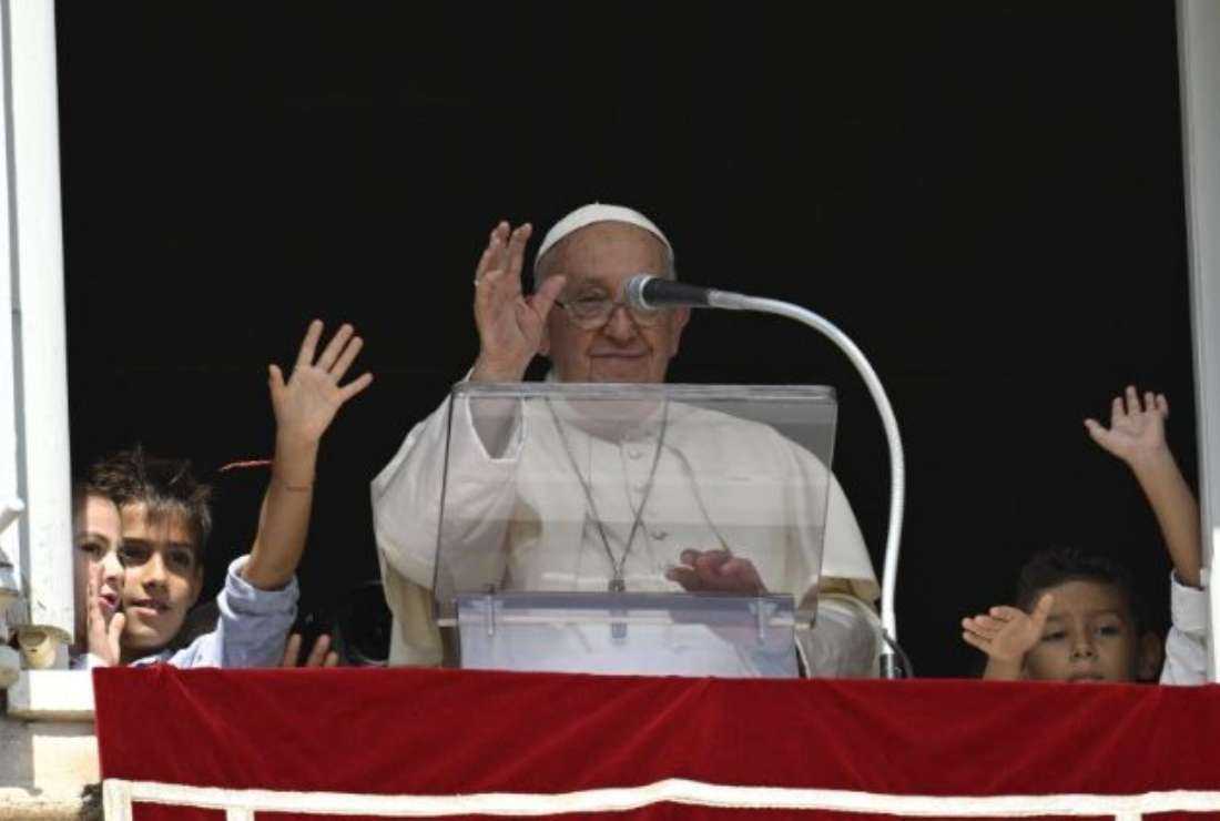 Pope Francis during Sunday Angelus with five children representing five continents
