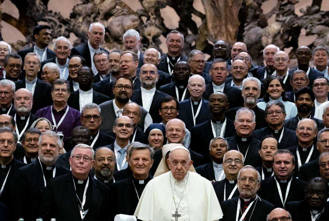 Pope Francis (center) poses for a family photograph with the participants of the Synod of Bishops at the Paul VI Hall in the Vatican on Oct. 23.