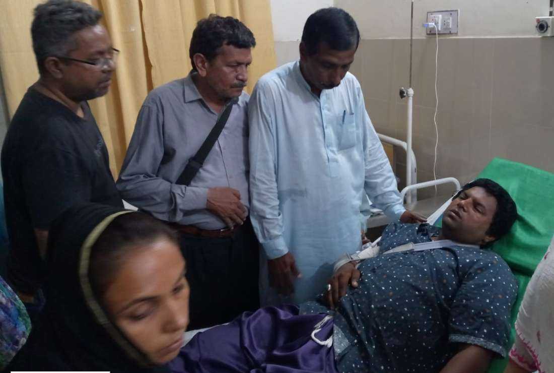 A team from Human Rights Focus Pakistan (HRFP) visit Pastor Eliezer Sidhu in a hospital in Faisalabad, in Pakistan.