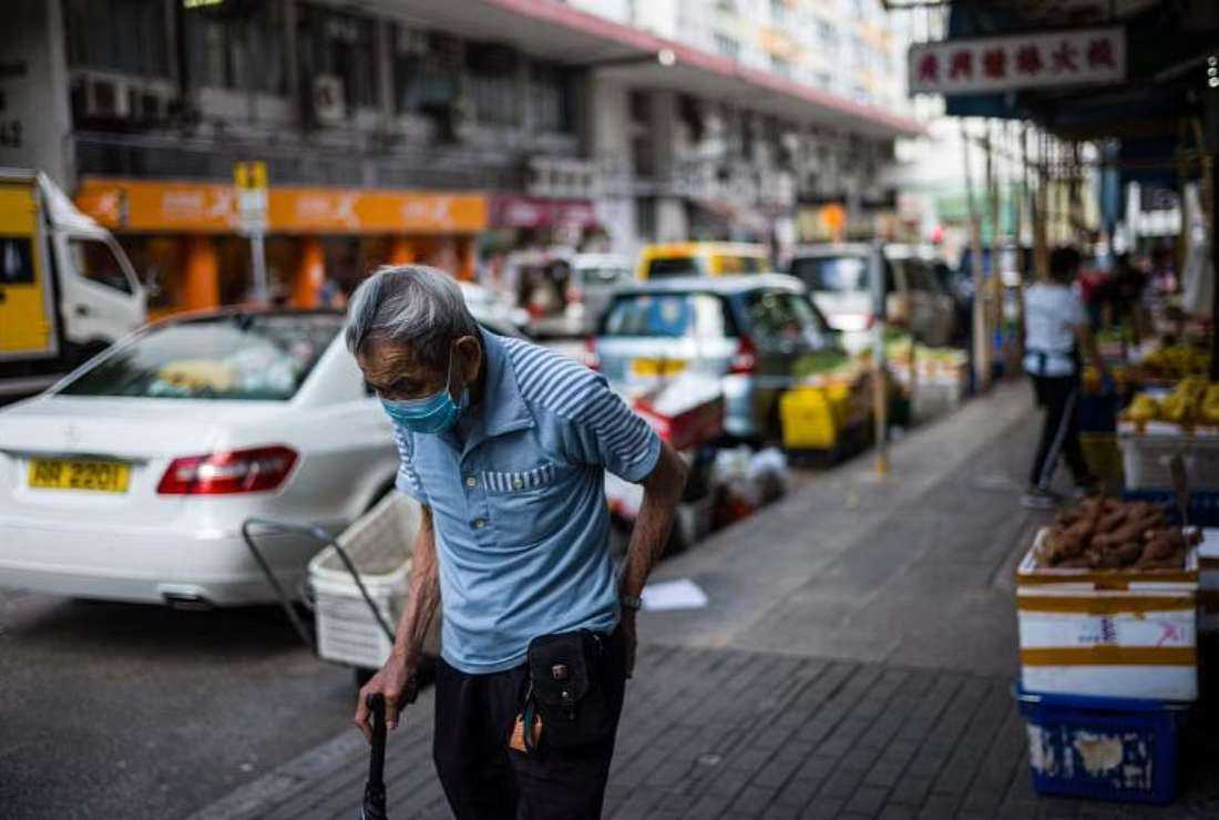 An elderly man wearing a face mask is seen on a street in Hong Kong during the Covid-19 pandemic in this file image. A new survey has highlighted the struggles of those taking care of the city's elderly.