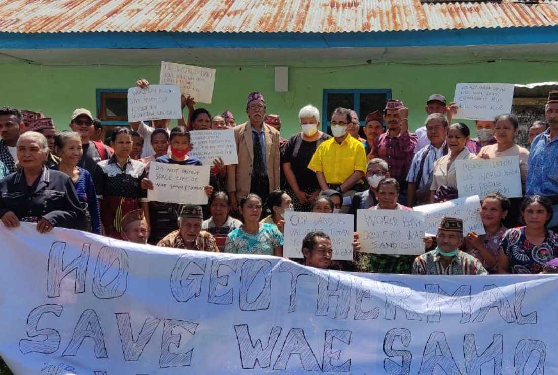  In this May 9, 2022 photo, residents of Wae Sano village on the Catholic-majority majority Flores Island of Indonesia pose with World Bank representatives after a meeting where they expressed their opposition to a geothermal project. The World Bank has now canceled funding for the project.