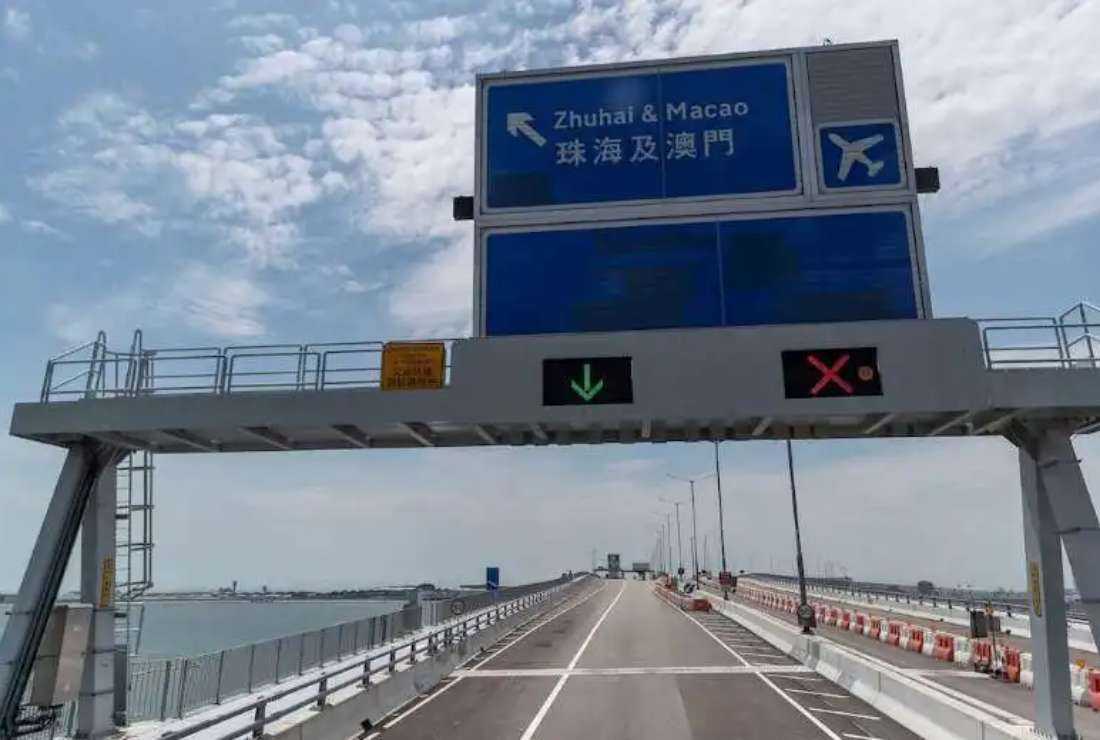 A road sign for Macau is seen near the Hong Kong-Zhuhai-Macau Bridge.