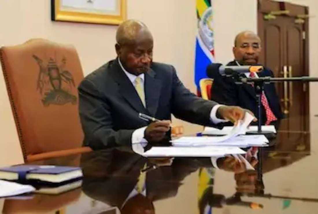 Uganda President Yoweri Museveni signs an anti-homosexuality bill into law